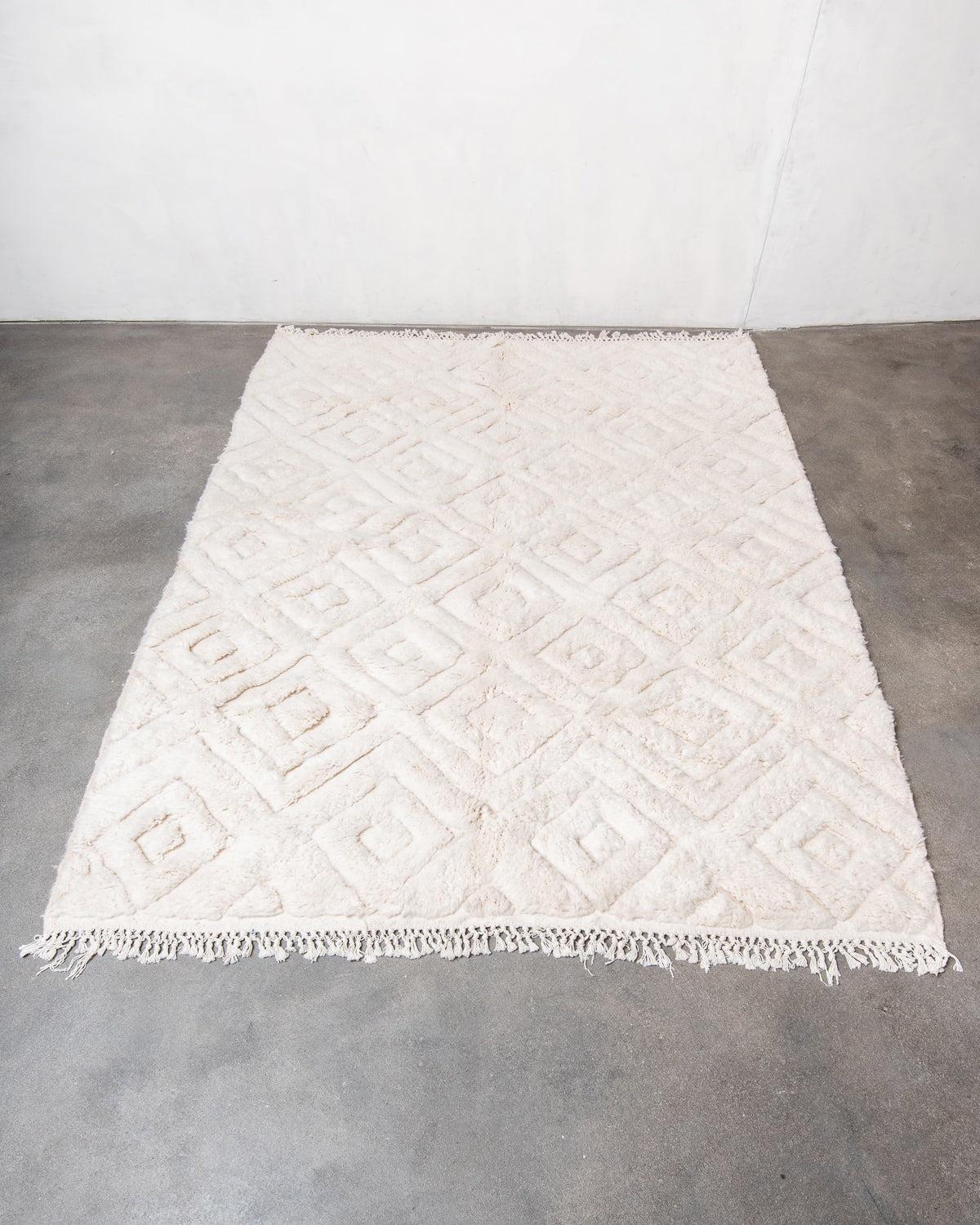 Modern, designer, handcrafted Berber rug from Morocco. Beniourain carpet with beautiful colours and patterns and fluffy wool texture.